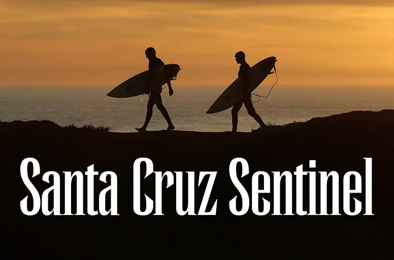 2 surfers walking with Santa Cruz Sentinel masthead