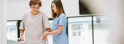 Rehab homepage Rehab professional helping older woman with walker